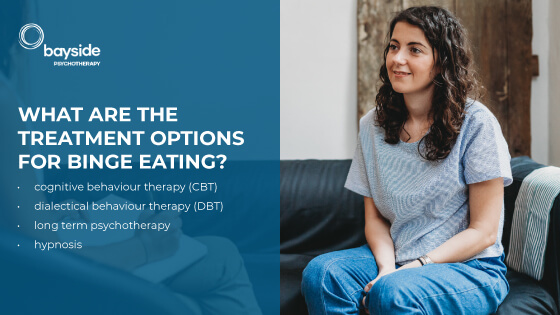 young woman with long wavy hair sitting on a couch and looking very optimistic and text about the binge eating treating options