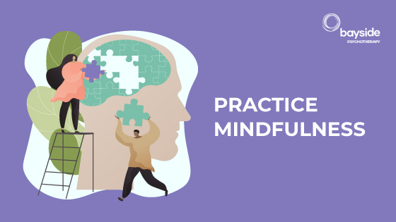 illustration with a woman on a stair assembling a puzzle and a man bringing pieces of the puzzle, on a purple background, with the text practice mindfulness and Bayside Psychotherapy logo