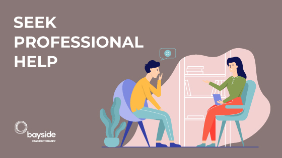 illustration with a woman and a man sitting on chairs and discussing in an office with a white shelf with books in the background on a latte brown background with the text seek professional help and Bayside Psychotherapy logo