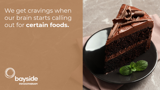 Picture with a slice of tasty chocolate cake and a mint leaf on a brown plate on the right, a quote about food on the left and the Bayside Psychotherapy logo