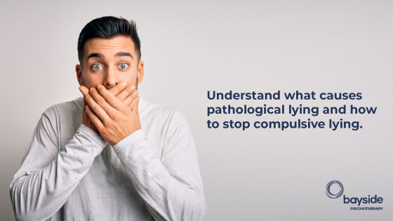 a young man with black hair and big blue eyes, wearing a grey t-shirt, covering his mouth with both hands and a text about the causes of pathological lying and how to stop it with the Bayside Psychotherapy logo at the bottom right