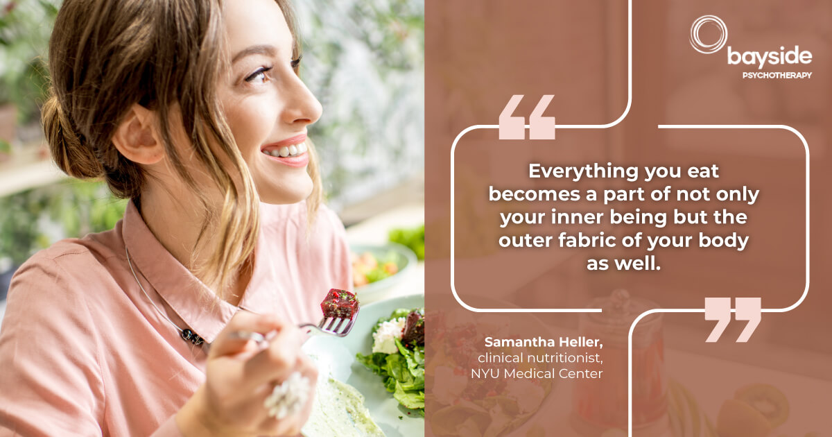 illustration with Samantha Heller's quote about nutrition on the right and a happy smiling woman eating healthy food on a brown background and Bayside Psychotherapy logo