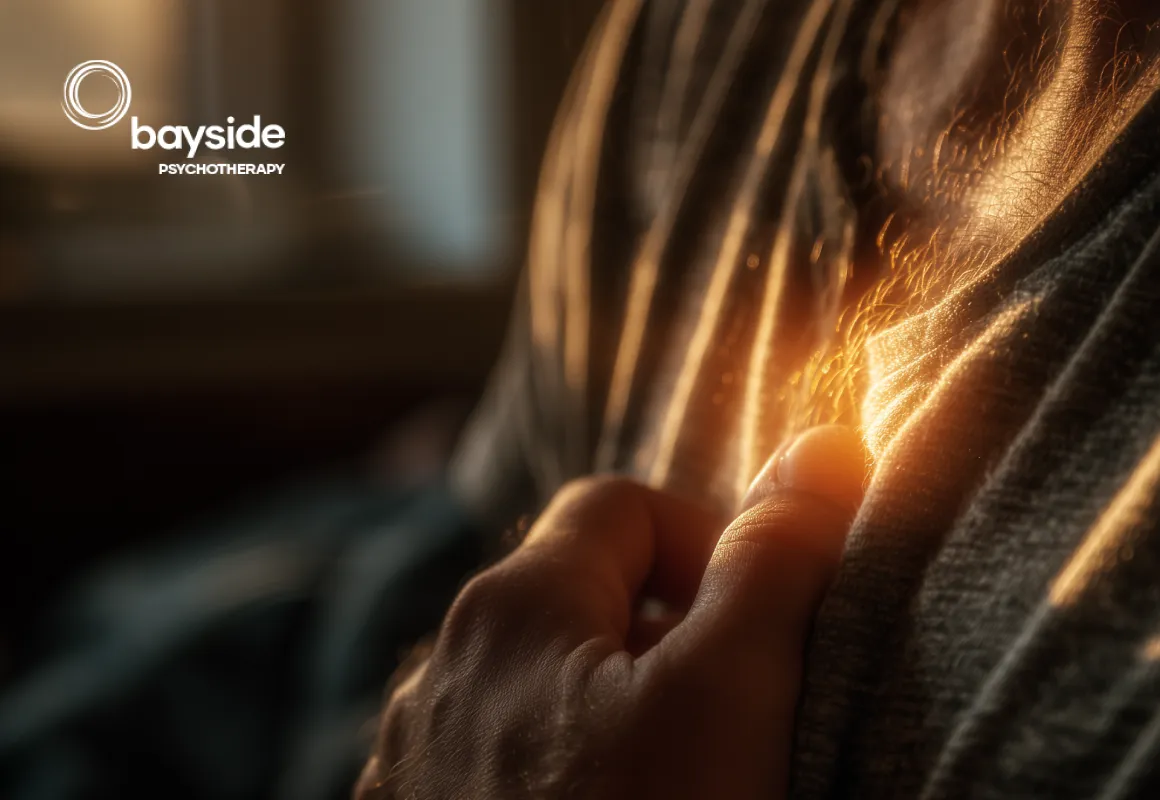 illustration coloured in brown shades showing a young sad person with closed eyes sitting with their hands holding their knees with text about the emotions experience by bulimics
