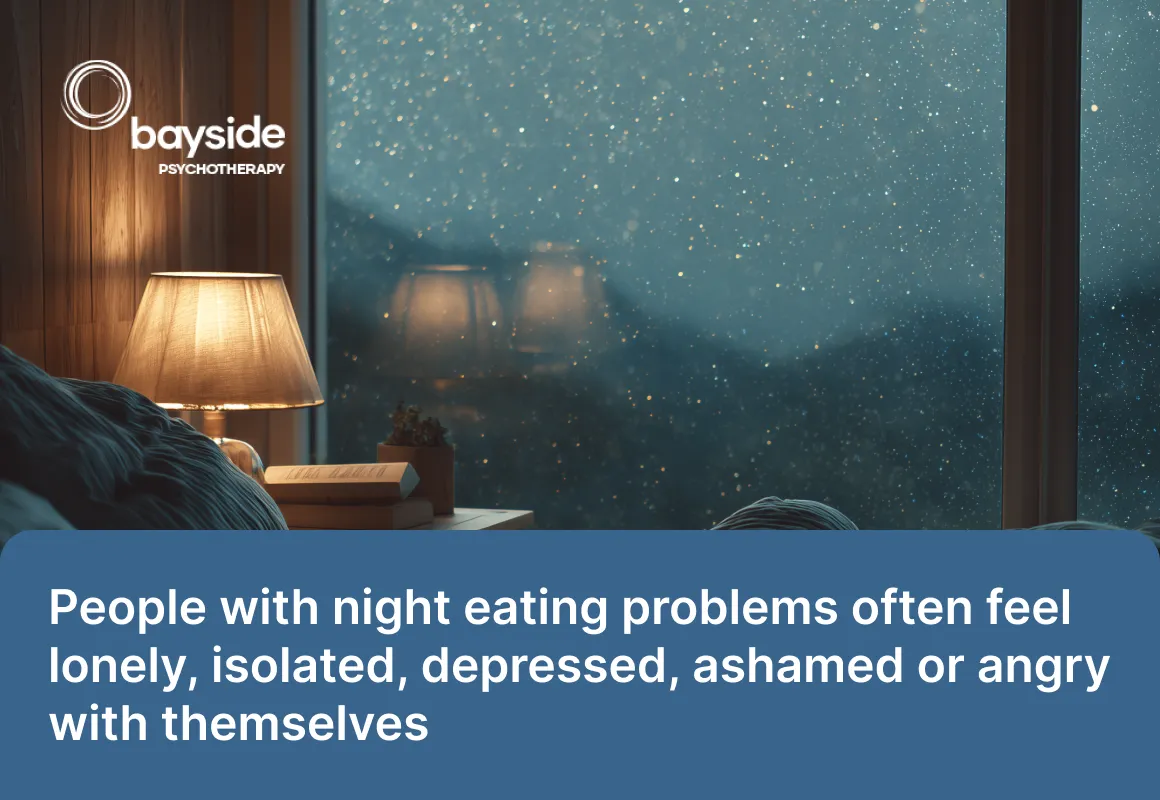 man with black hair holding his head with his head while eating pasta and looking worried and a quote about night eating syndrome