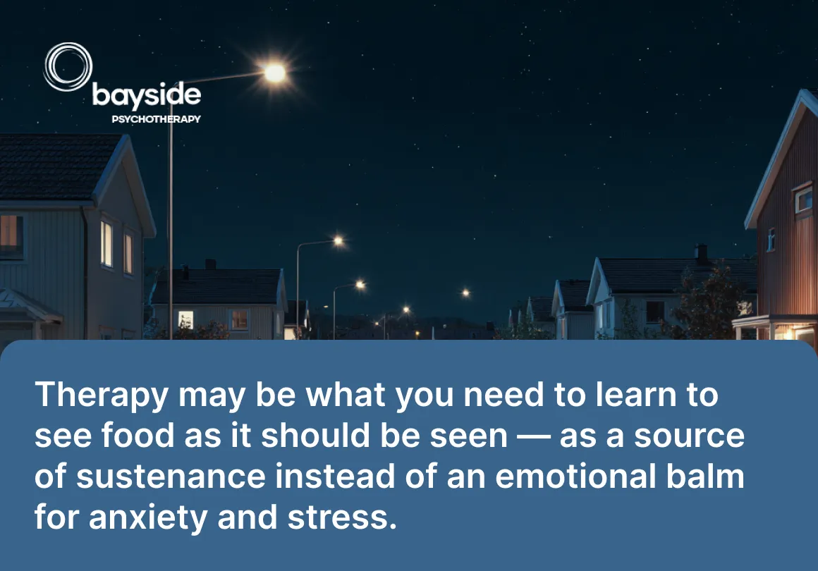 women with black hair wearing a light blue T-shirt explaining something to other women and a quote about therapy and food