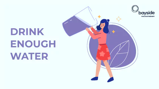 7 Tips to Break Away From Binge Eating 5 illustration with a woman wearing pink and drinking water from an oversized glass on a light blue background with the text drink enough water and Bayside Psychotherapy logo